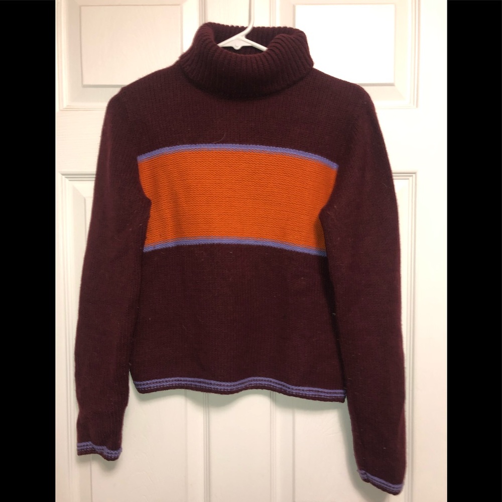 Purple and orange sweater.